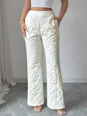White floral textured high-waisted maternity pants with a wide leg