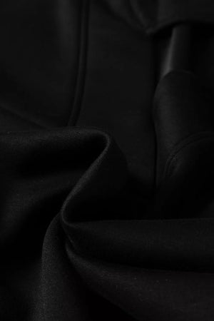 Black collared V-neck sweatshirt and pants set, soft knit fabric detail.