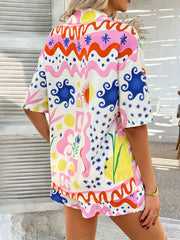 Coastal Tile Print Co-ord Set in multicolor with abstract shapes and sun pattern, short sleeve button-up top and shorts.