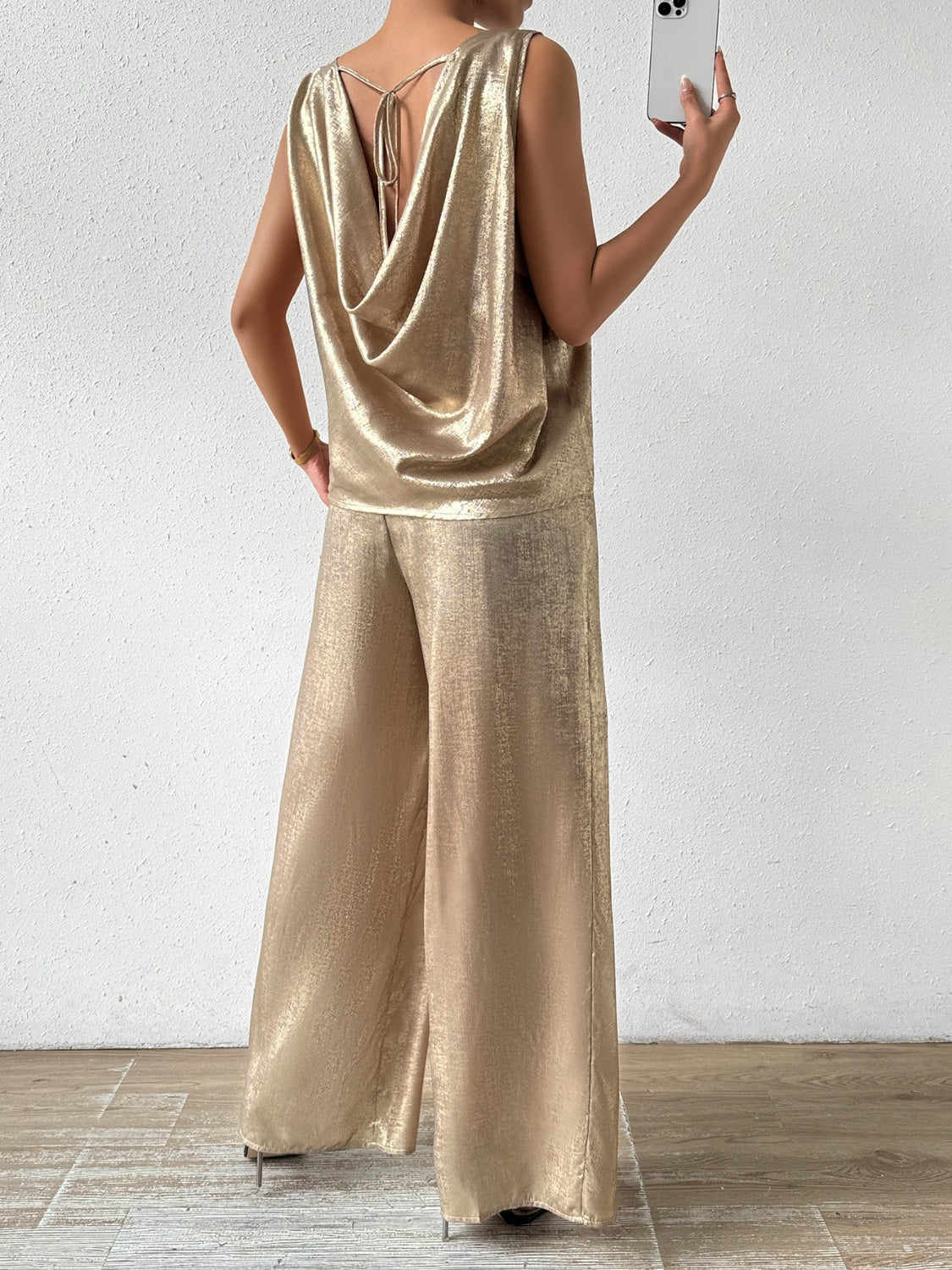 Camel cowl neck sleeveless top with tie back and wide leg palazzo pants.