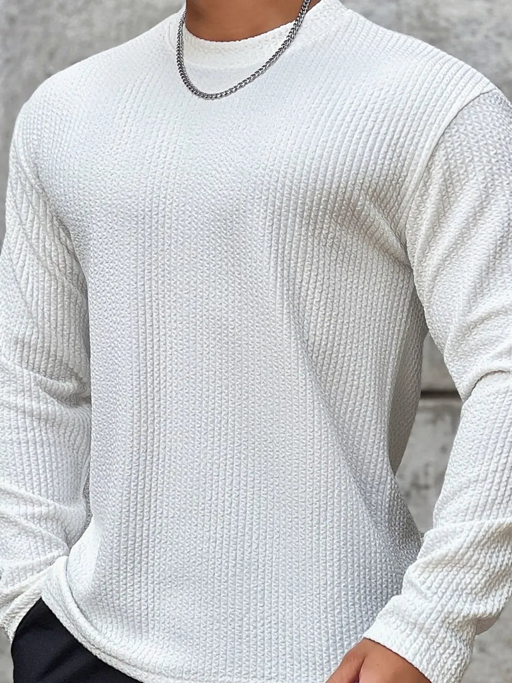 Men's white long sleeve t-shirt with textured fabric and round neck.