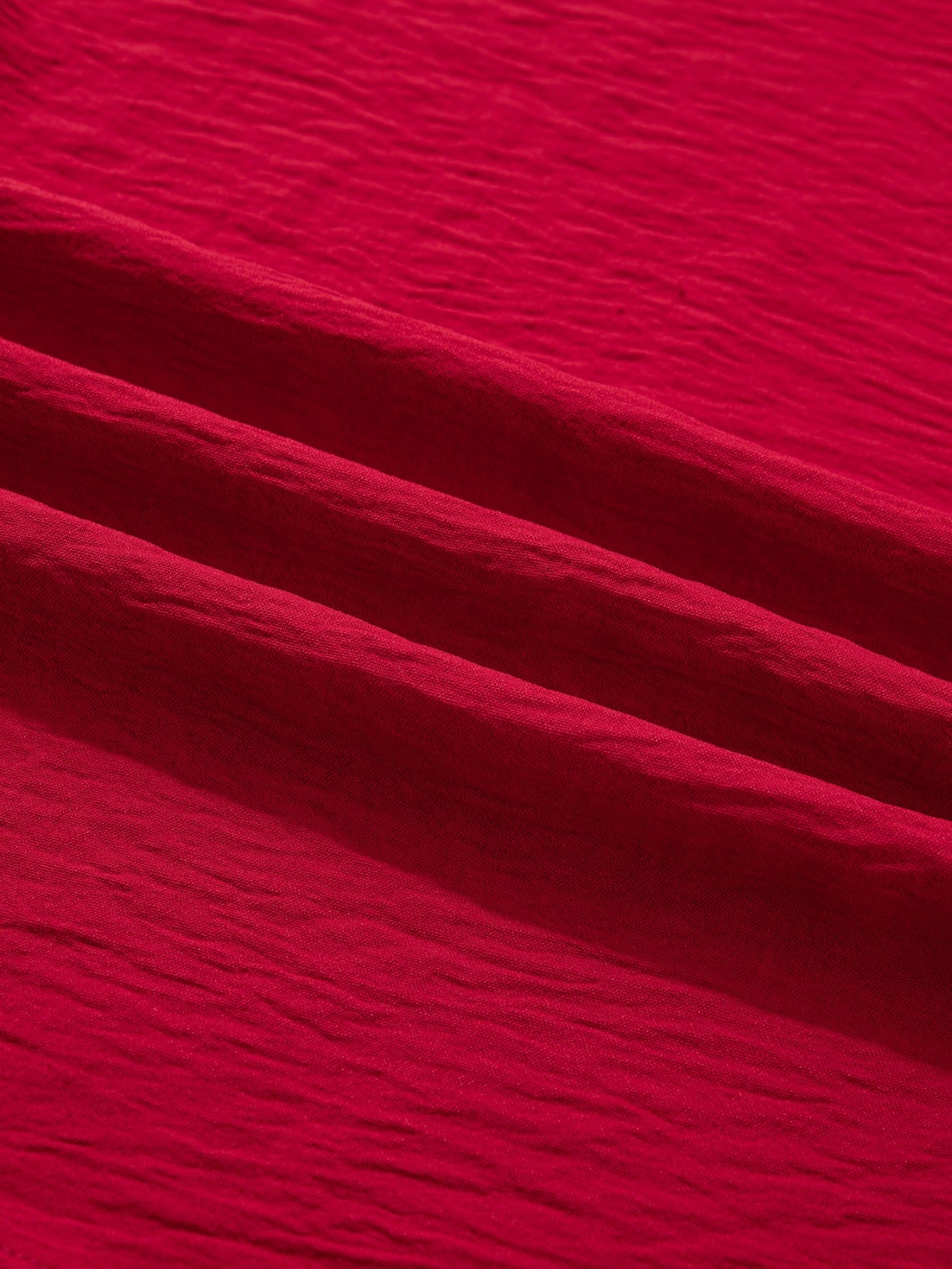 Deep red braided V-neck blouse with textured fabric detail