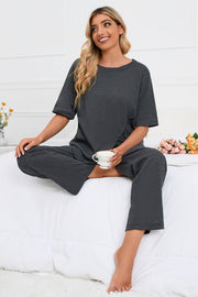 Dark gray ribbed tee with asymmetric slit and wide leg lounge pants set.