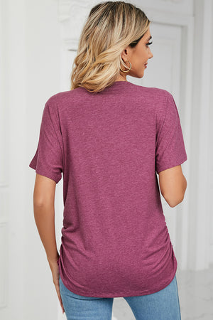 Dusty Pink tee with V-neck, short sleeves, and side ruching detail.