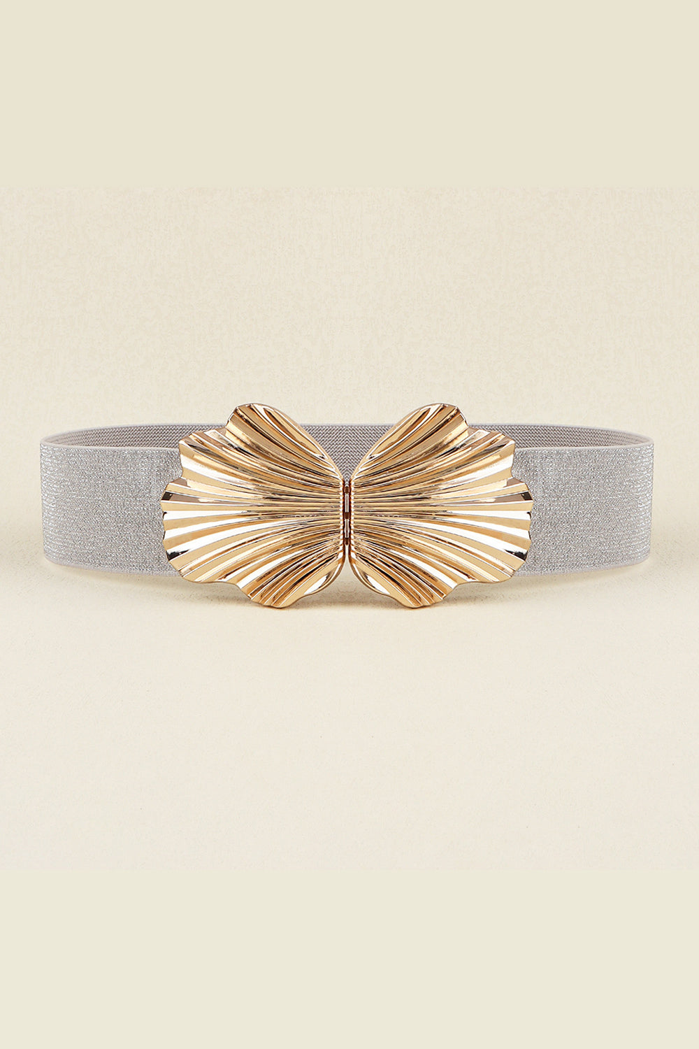 Silver elastic belt with a sculpted gold butterfly buckle.