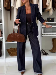 Dark blue denim pant suit with double-breasted blazer and wide-leg pants.
