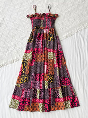 Frilled smocked leopard maxi dress with patchwork animal print and tiered skirt.