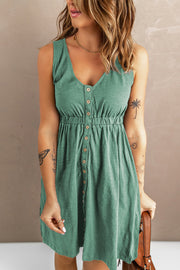 Green button-down mini dress with gathered waistline and V-neck.