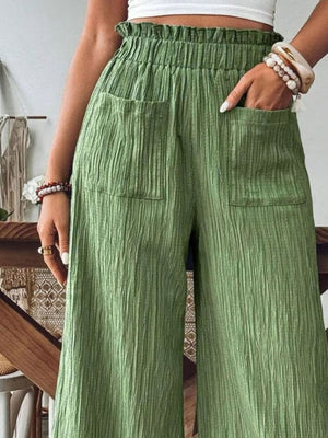 Textured wide-leg palazzo trousers in matcha green with elastic waist and pockets.