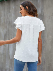 White textured voile blouse with flutter sleeves and a dotted pattern.