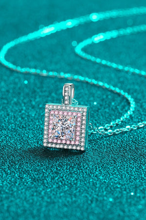 Silver moissanite halo pendant necklace with princess-cut center stone and pink accent stones.