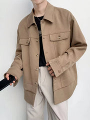 Oversized khaki button-down jacket with chest pockets and button cuffs