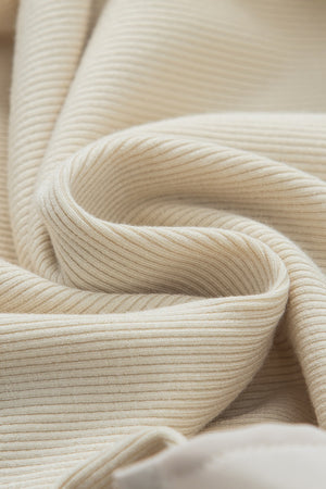 Beige ribbed mock neck top fabric detail