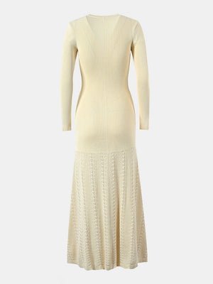 Pastel yellow ribbed knit maxi dress with decorative button detail and patterned skirt.