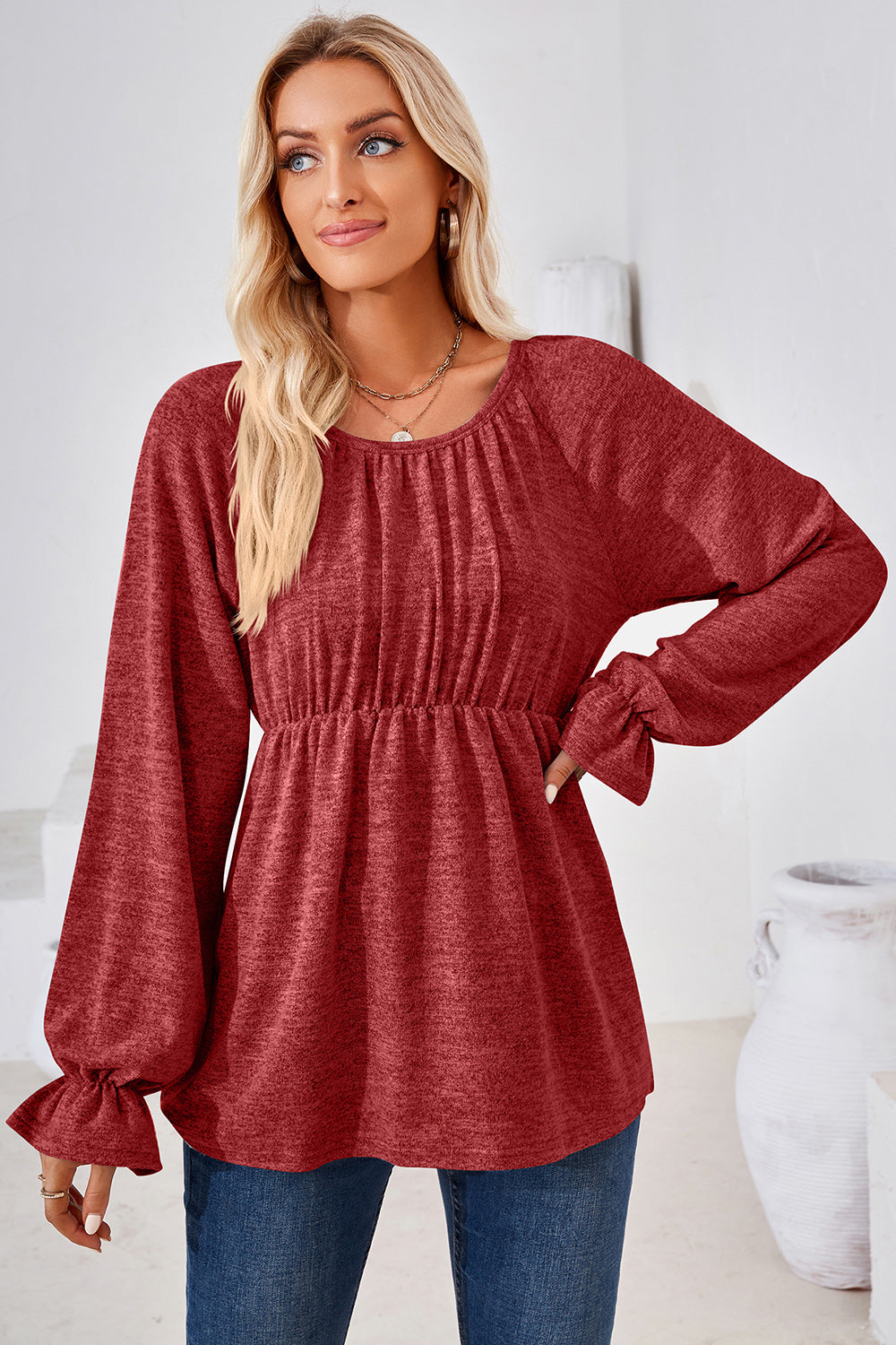 Burgundy peasant blouse with cinched waist and ruffled bell sleeves.