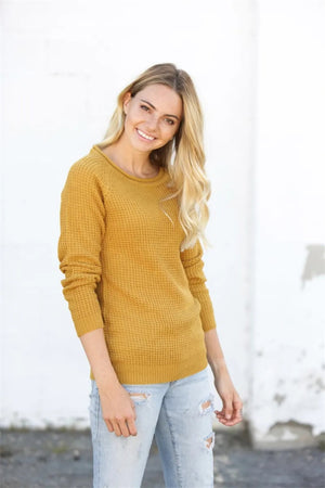 Yellow honeycomb knit pullover sweater with raglan sleeves and crew neck.