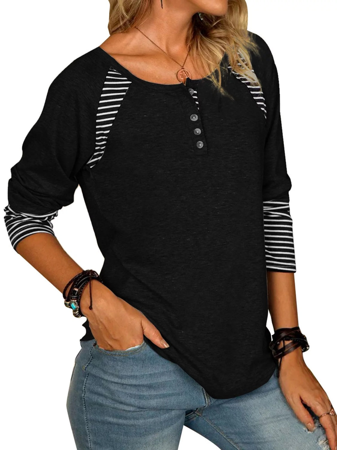 Black raglan henley tee with striped sleeves and button detail