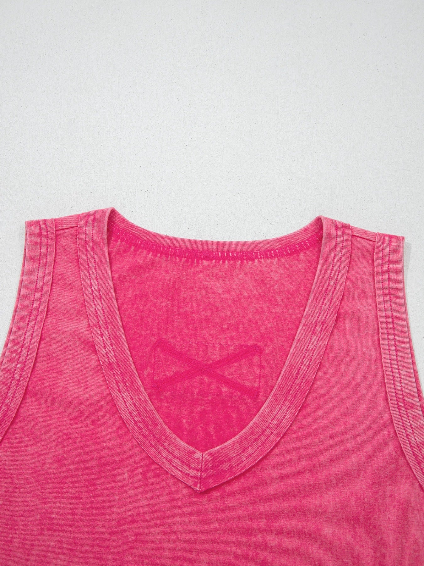 Textured cotton v-neck tank top in pink with a subtle X detail on the chest.