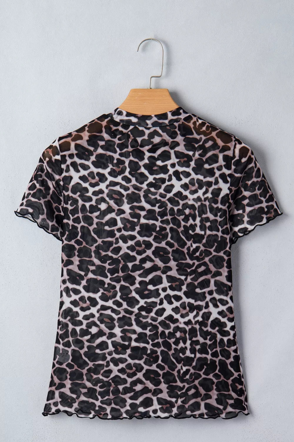 Leopard print sheer mesh t-shirt with short sleeves and lettuce trim.
