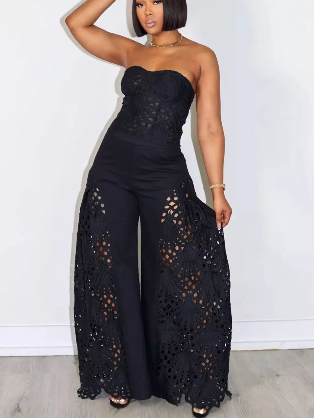 Black lace cutout tube top and wide-leg pants set with airy details.