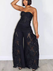 Black lace cutout tube top and wide-leg pants set with airy details.