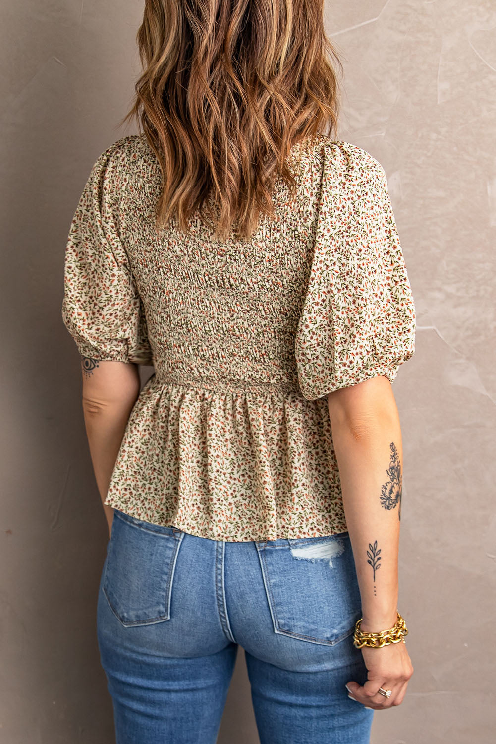 Floral smocked bodice peplum top with puff sleeves