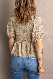 Floral smocked bodice peplum top with puff sleeves
