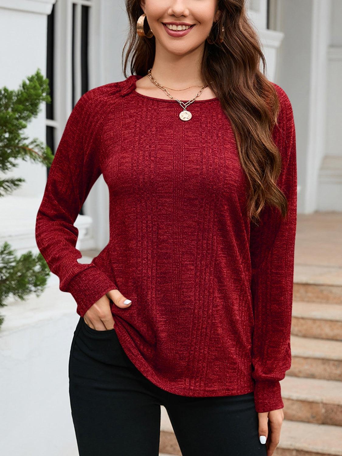 Textured knit raglan sleeve top in wine with a crew neck and long sleeves.
