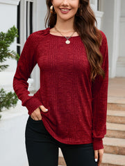 Textured knit raglan sleeve top in wine with a crew neck and long sleeves.