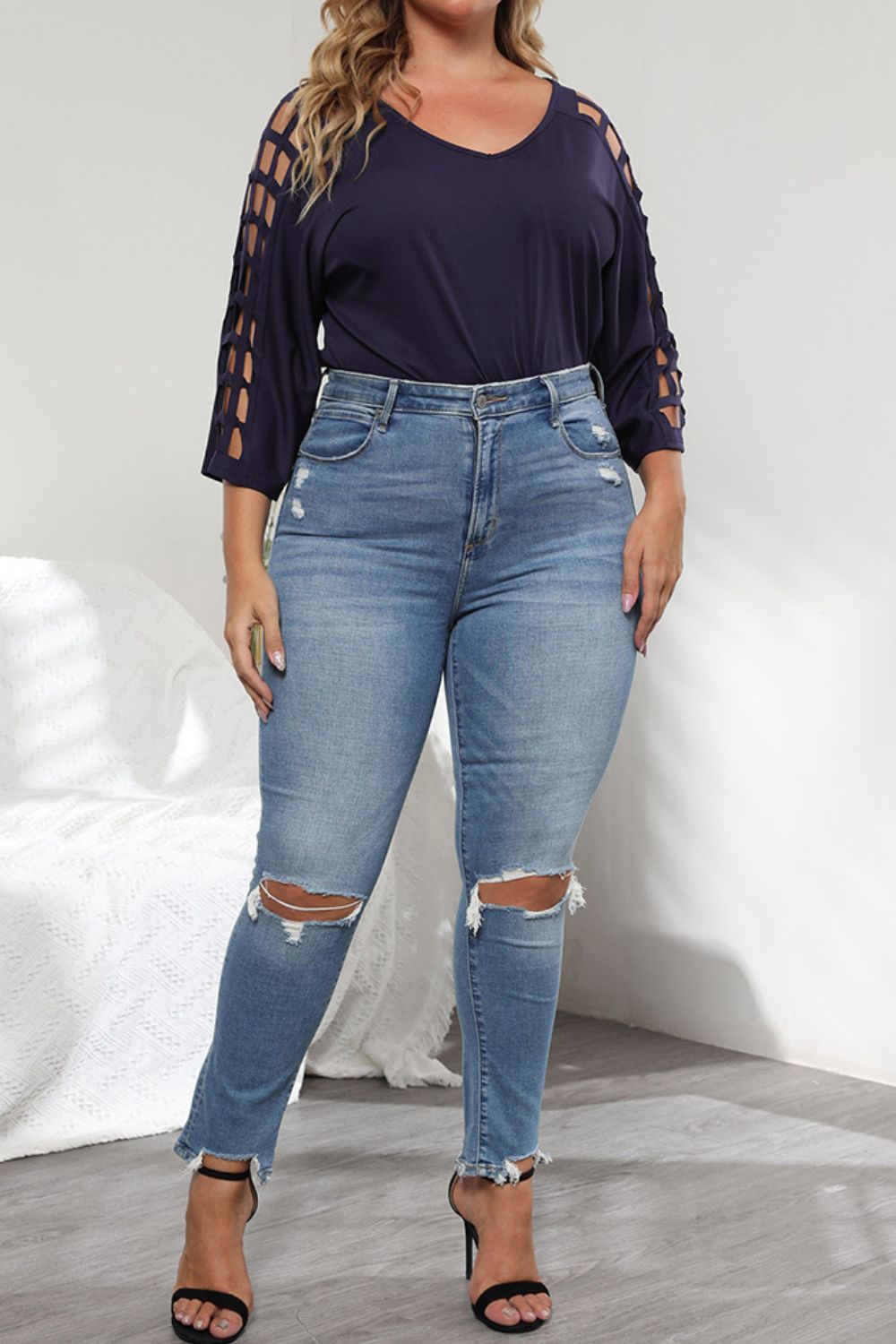 Lattice sleeve v-neck top in dark navy with distressed jeans and black heels