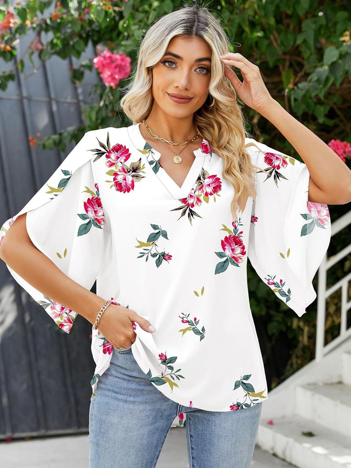 White floral print blouse with flutter sleeves and V-neck