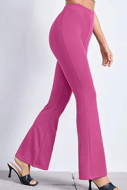 Textured flare leggings in hot pink with a subtle ribbed texture, styled with heels.