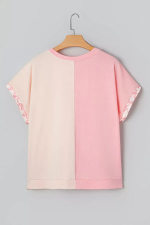 Maternity color block t-shirt in pink and cream cotton with floral applique trim on sleeves.