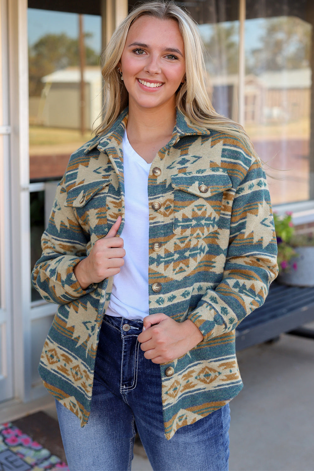 Aztec print shacket in dusty blue with patch pockets and button front.
