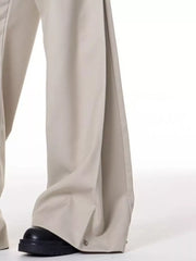 Men's beige wide-leg sweatpants with snap closure detail at the hem.