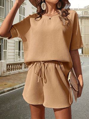 Beige waffle knit drawstring co-ord set with short sleeves and shorts.