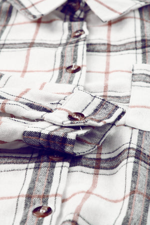 Oversized white plaid shacket with button details and a casual, comfortable fit.