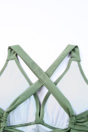 Sage ruched halter swim dress back with crisscross straps and tie detail.