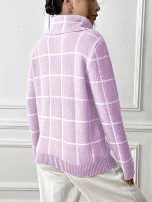 Pink purple turtleneck sweater with white grid pattern and ribbed trim.