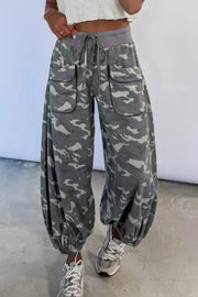 Camouflage barrel cargo pants with button-flap pockets and drawstring waist.