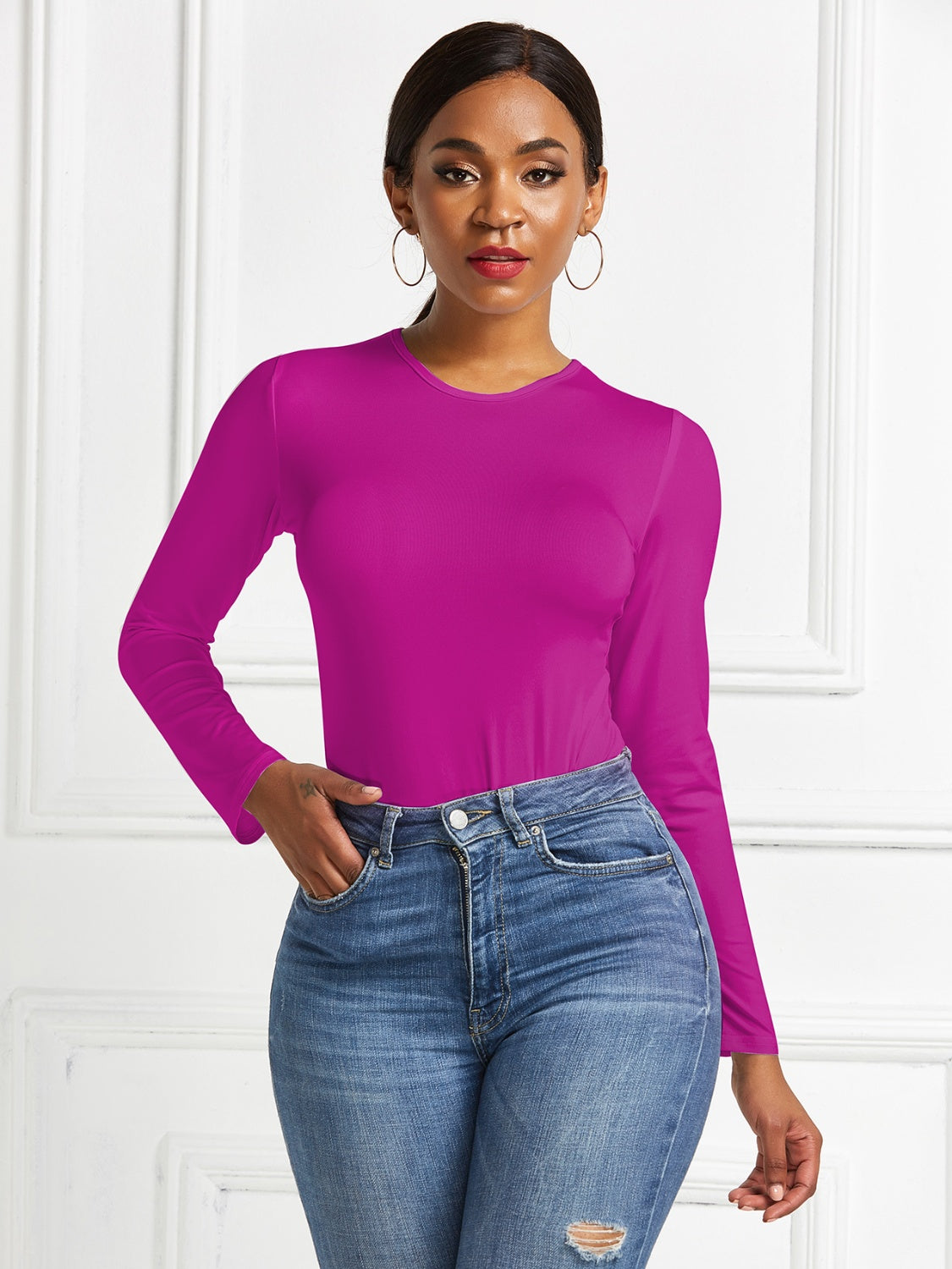Sculpted ribbed jersey bodysuit in hot pink with long sleeves and a crew neck.