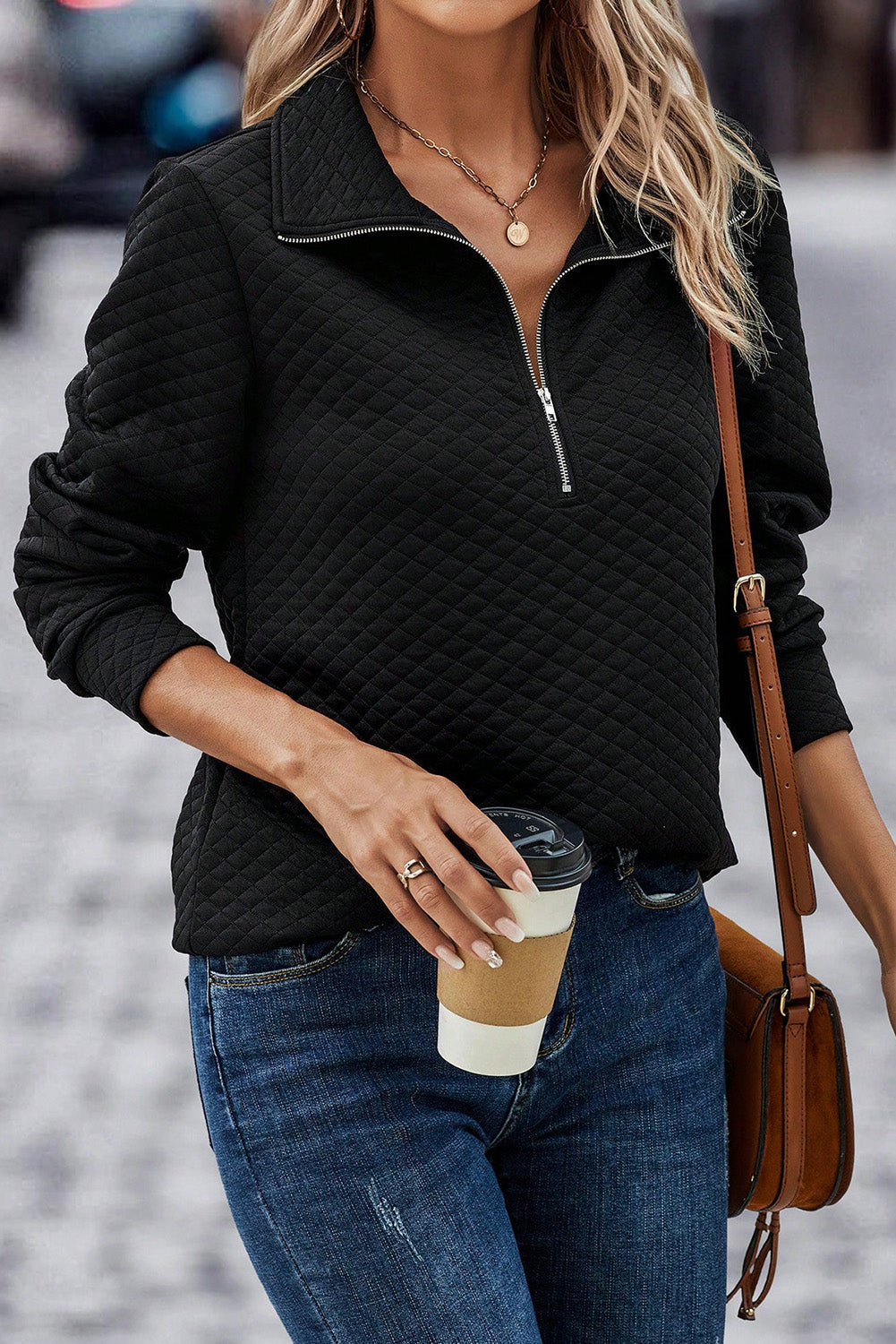 Black diamond quilted zip-neck pullover sweatshirt with a silver zipper.