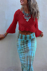 Deep Red crochet crop top with bell sleeves and V-neck, styled with a tie-dye skirt.