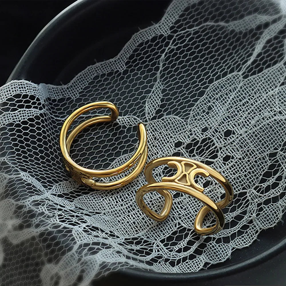 Gold double banded open ring with cutout detail.