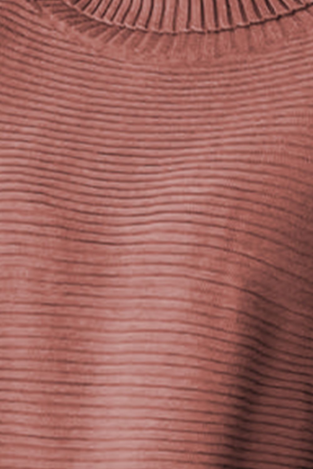 Brick red ribbed turtleneck sweater with a textured knit and a high neckline.