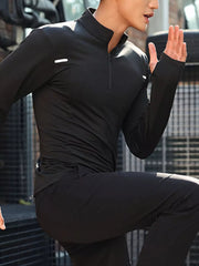 Men's black quarter-zip active t-shirt with thumbholes and reflective details.
