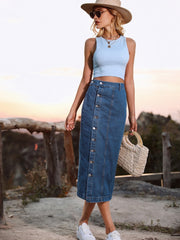 Button-front denim midi skirt in blue with a full button closure and seam details.