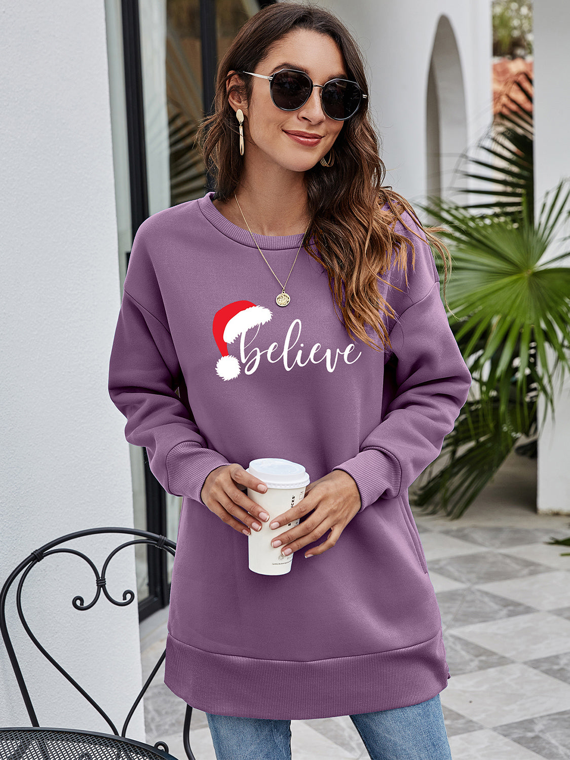 Dusty Purple Christmas graphic tunic sweatshirt with Santa hat and "Believe" text.