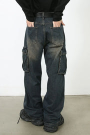Faded wash dark wide-leg cargo jeans with multiple pockets.