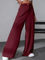 Burgundy high-waisted pleated wide-leg maternity trousers with button detail.